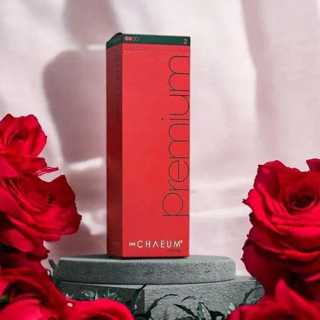 Chaeum PREMIUM 2 hyaluronic acid dermal filler box with roses and pedestal background